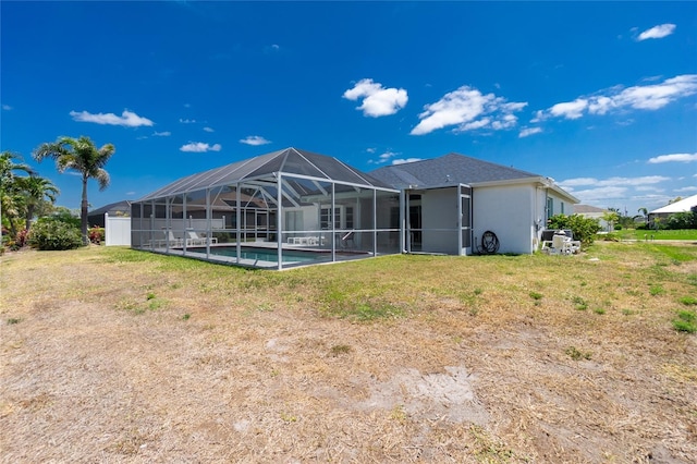 162 Fairway Rd, Rotonda West, FL 33947 - rear view of house featuring stucco siding, an outdoor pool, and a lanai