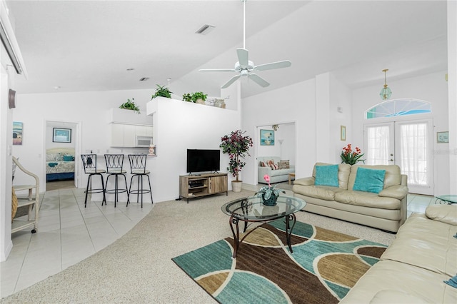 162 Fairway Rd, Rotonda West, FL 33947 - living room featuring light tile patterned floors, high vaulted ceiling, a ceiling fan, and visible vents