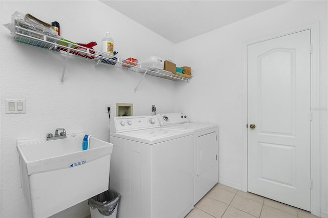 162 Fairway Rd, Rotonda West, FL 33947 - laundry area featuring laundry area, a sink, independent washer and dryer, and light tile patterned floors