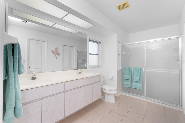 162 Fairway Rd, Rotonda West, FL 33947 - full bath with a sink, toilet, double vanity, and visible vents