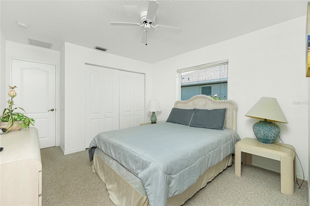162 Fairway Rd, Rotonda West, FL 33947 - bedroom featuring light carpet, a ceiling fan, baseboards, visible vents, and a closet