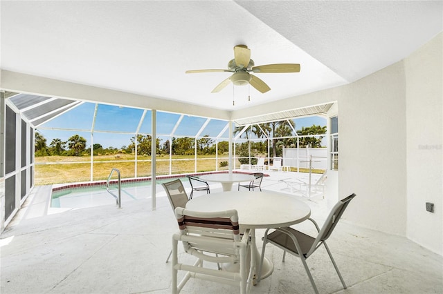 162 Fairway Rd, Rotonda West, FL 33947 - exterior space featuring glass enclosure, ceiling fan, and an outdoor pool