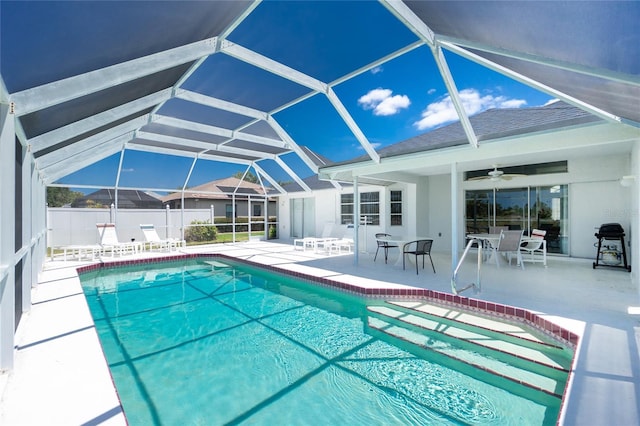 162 Fairway Rd, Rotonda West, FL 33947 - view of swimming pool with grilling area, a ceiling fan, a patio area, glass enclosure, and a fenced in pool
