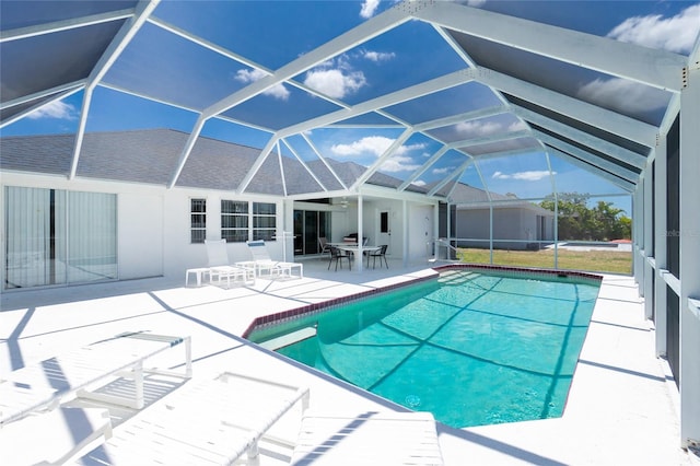 162 Fairway Rd, Rotonda West, FL 33947 - pool with outdoor dining area, glass enclosure, and a patio area
