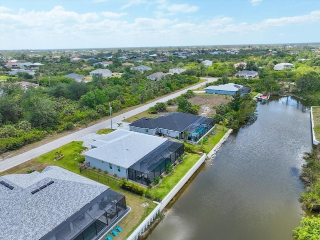 drone / aerial view with a residential view and a water view