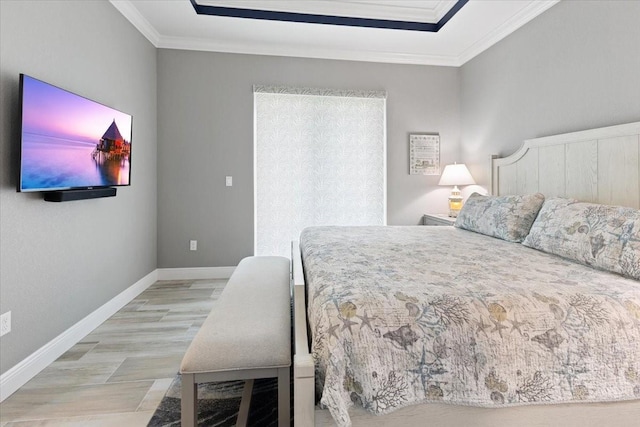 bedroom with baseboards and ornamental molding