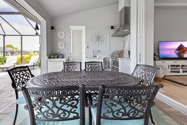 dining area featuring vaulted ceiling