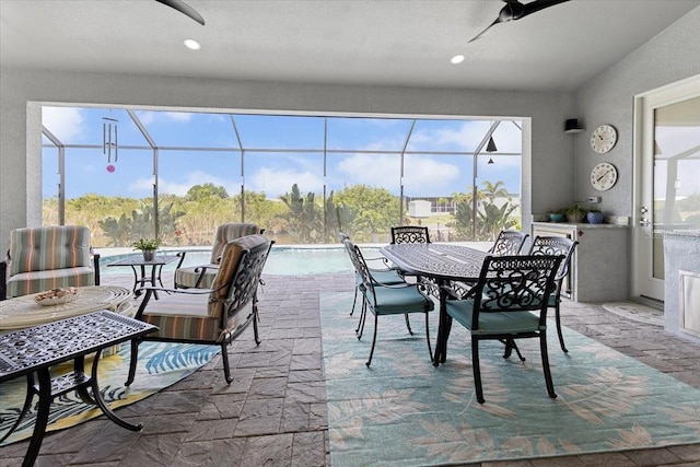 dining room featuring a sunroom and ceiling fan