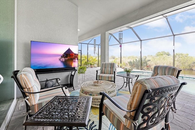 view of patio / terrace featuring a pool and glass enclosure