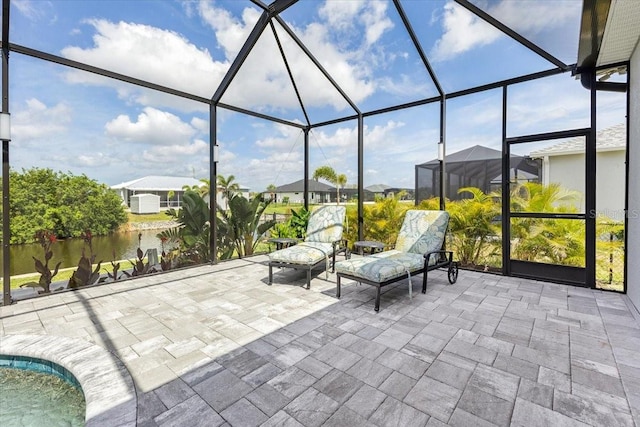 view of patio / terrace featuring a lanai, a residential view, and a pool