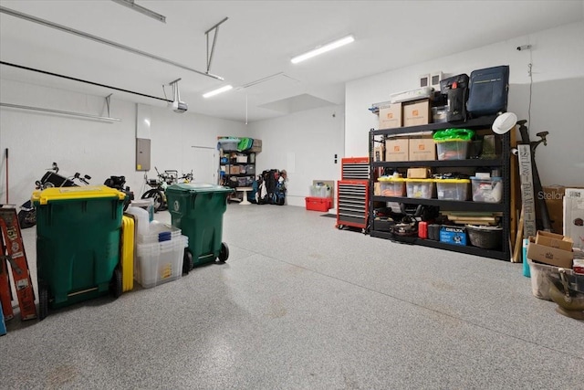garage featuring a garage door opener and electric panel