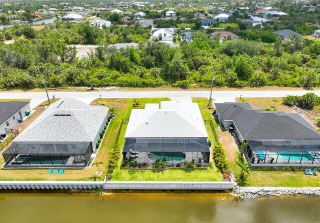 bird's eye view featuring a water view and a residential view