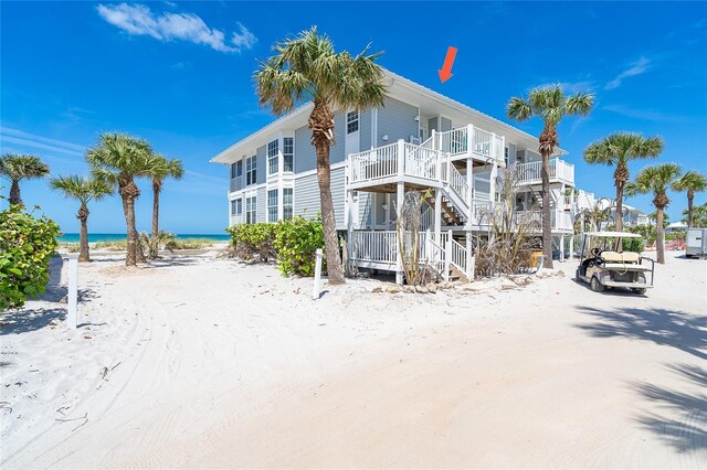 7548 Palm Island Dr S Unit 1724, Placida, FL 33946 - back of house with a water view, stairs, and a view of the beach