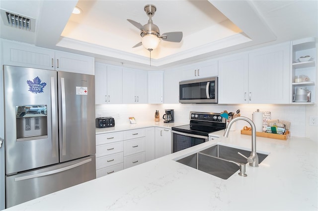 7548 Palm Island Dr S Unit 1724, Placida, FL 33946 - kitchen with a sink, a raised ceiling, stainless steel appliances, and visible vents