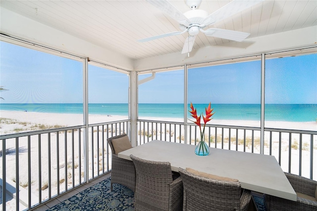 7548 Palm Island Dr S Unit 1724, Placida, FL 33946 - sunroom featuring a beach view, beam ceiling, and a water view