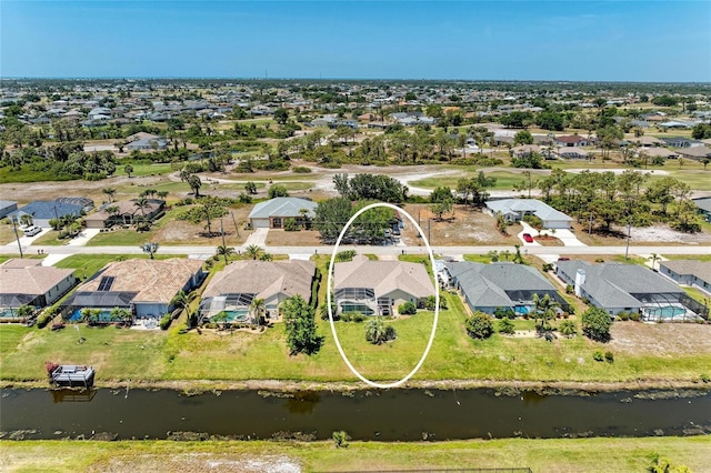 aerial view with a residential view and a water view
