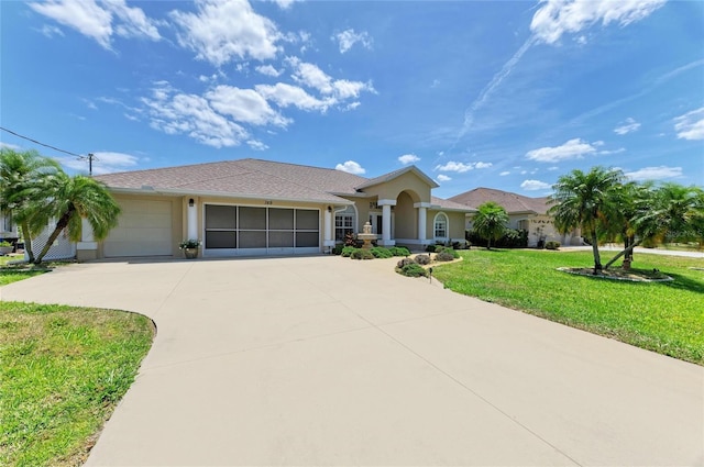 view of front of house with a garage, stucco siding, driveway, and a front lawn