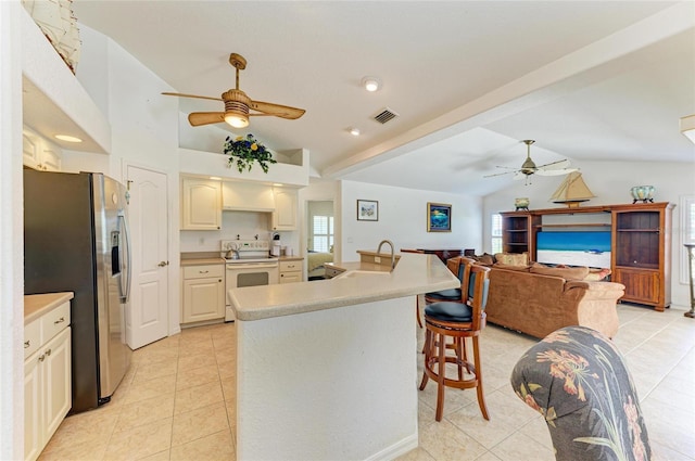 kitchen with white electric range, a ceiling fan, lofted ceiling, and stainless steel refrigerator with ice dispenser