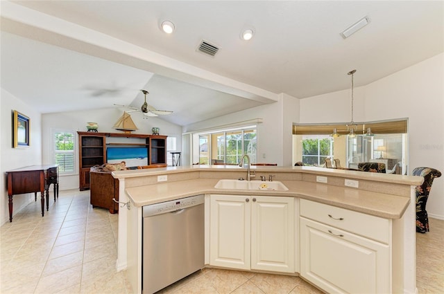kitchen with stainless steel dishwasher, a sink, vaulted ceiling, and open floor plan