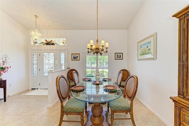 dining area featuring light tile patterned floors, an inviting chandelier, and a wealth of natural light
