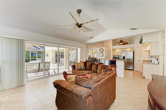living room featuring ceiling fan and light tile patterned flooring