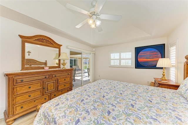 bedroom with a ceiling fan and access to exterior