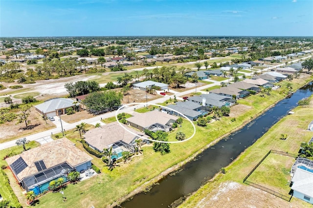 aerial view with a water view and a residential view