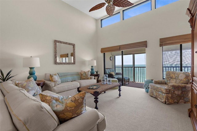 2950 N Beach Rd Unit B324, Englewood, FL 34223 - carpeted living area featuring a ceiling fan and a towering ceiling