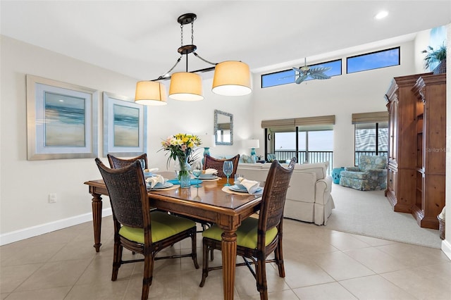 2950 N Beach Rd Unit B324, Englewood, FL 34223 - dining area with light tile patterned floors, baseboards, a high ceiling, light carpet, and recessed lighting