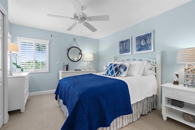 2950 N Beach Rd Unit B324, Englewood, FL 34223 - bedroom featuring light colored carpet, a ceiling fan, and baseboards