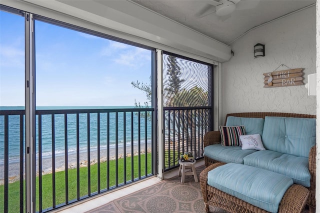2950 N Beach Rd Unit B324, Englewood, FL 34223 - sunroom / solarium with a ceiling fan, view of water and beach, and vaulted ceiling