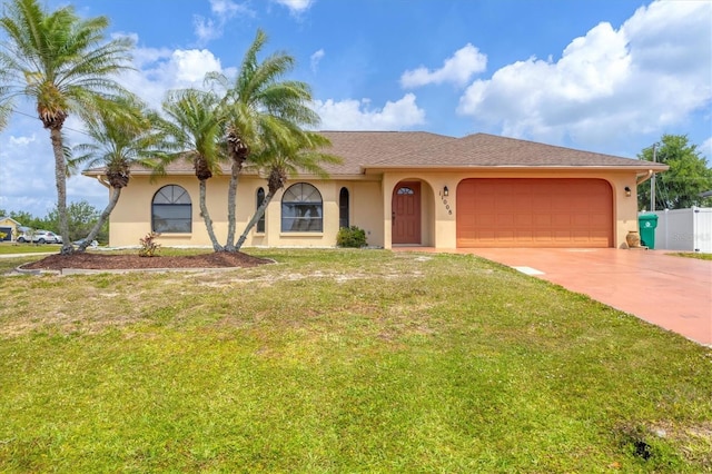 single story home featuring fence, a garage, stucco siding, a front yard, and concrete driveway