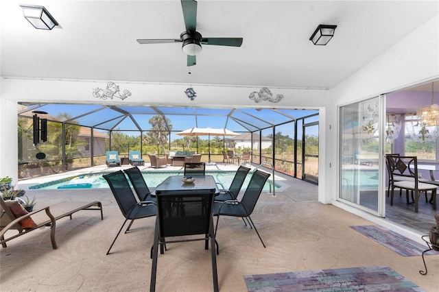 view of patio / terrace featuring outdoor dining area, glass enclosure, an outdoor pool, and ceiling fan