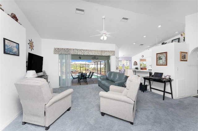 living room with carpet floors, ceiling fan, visible vents, and lofted ceiling