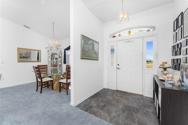 foyer featuring baseboards, visible vents, and a notable chandelier