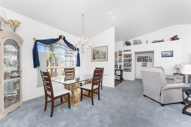 dining area featuring an inviting chandelier, vaulted ceiling, and carpet flooring