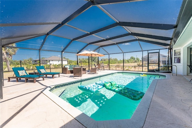 pool featuring a lanai and a patio area