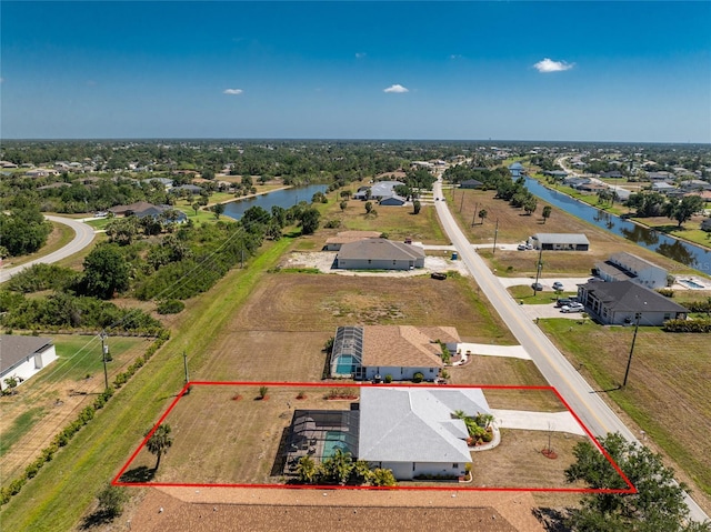 aerial view featuring a water view and a residential view