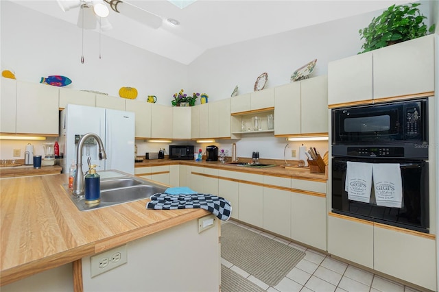 kitchen featuring a ceiling fan, light tile patterned flooring, high vaulted ceiling, a sink, and black appliances