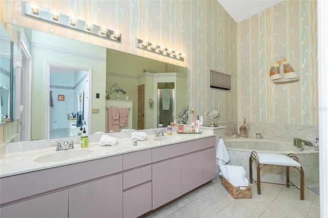 full bathroom with double vanity, a sink, tile patterned floors, and wallpapered walls