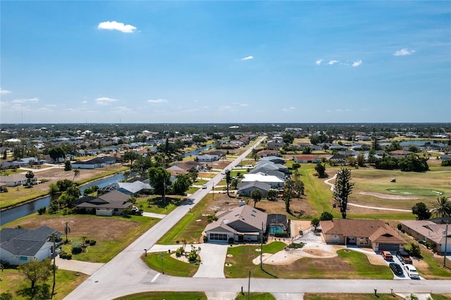 aerial view with a residential view and a water view
