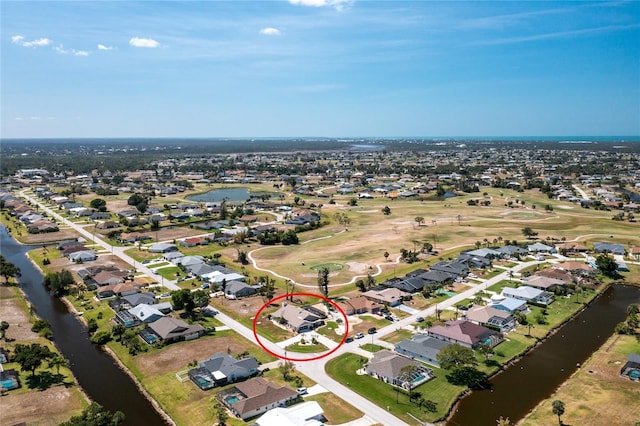 aerial view featuring a water view and a residential view
