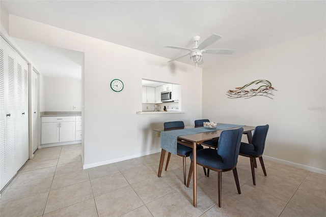 1531 Placida Rd Unit 4-103, Englewood, FL 34223 - dining room with light tile patterned floors, a ceiling fan, and baseboards