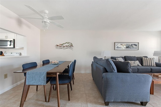 1531 Placida Rd Unit 4-103, Englewood, FL 34223 - dining room with ceiling fan, light tile patterned floors, and baseboards