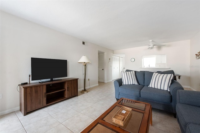 1531 Placida Rd Unit 4-103, Englewood, FL 34223 - living area with light tile patterned floors, baseboards, and ceiling fan