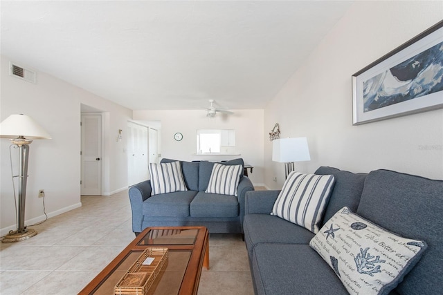 1531 Placida Rd Unit 4-103, Englewood, FL 34223 - living room with light tile patterned floors, a ceiling fan, and baseboards