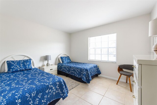 1531 Placida Rd Unit 4-103, Englewood, FL 34223 - bedroom featuring light tile patterned floors and baseboards