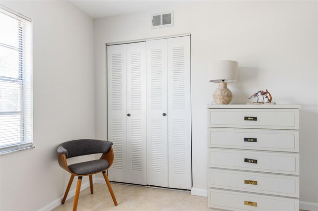 1531 Placida Rd Unit 4-103, Englewood, FL 34223 - sitting room with plenty of natural light, baseboards, and light tile patterned floors