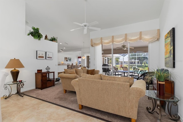 living area featuring a ceiling fan, baseboards, and light colored carpet
