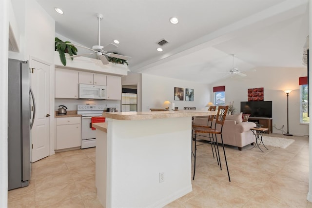 kitchen featuring white appliances, ceiling fan, vaulted ceiling, and open floor plan